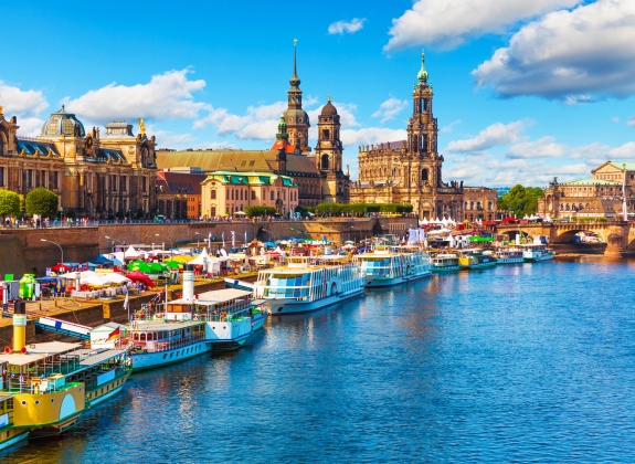 Dresden-Old-Town-Summer Colourful boats docked in the Elbe river alongside the city of Dresden, Germany.