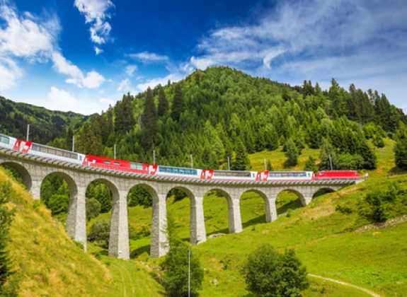The Glacier Express travels over a viaduct The Glacier Express travels over a viaduct