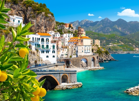 Beautiful view of Amalfi on the Mediterranean coast with lemons in the foreground, Italy