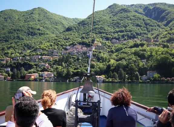 Tourists on the boat tour on the lake Como looking at the beautiful views