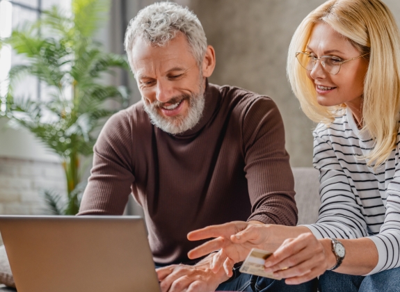 couple making a deposit with credit card