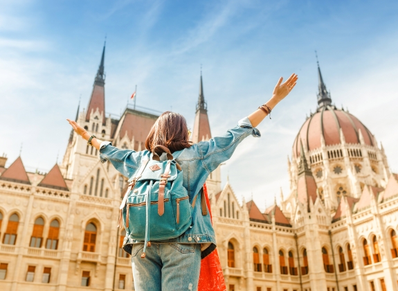 woman enjoying great view of the Parliament building in Budapest city