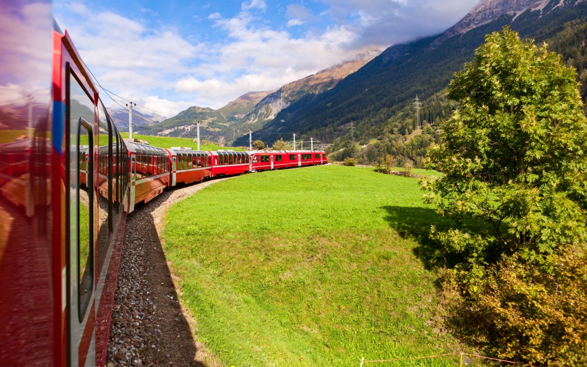 The Bernina Express A train travels round a curved track in summer