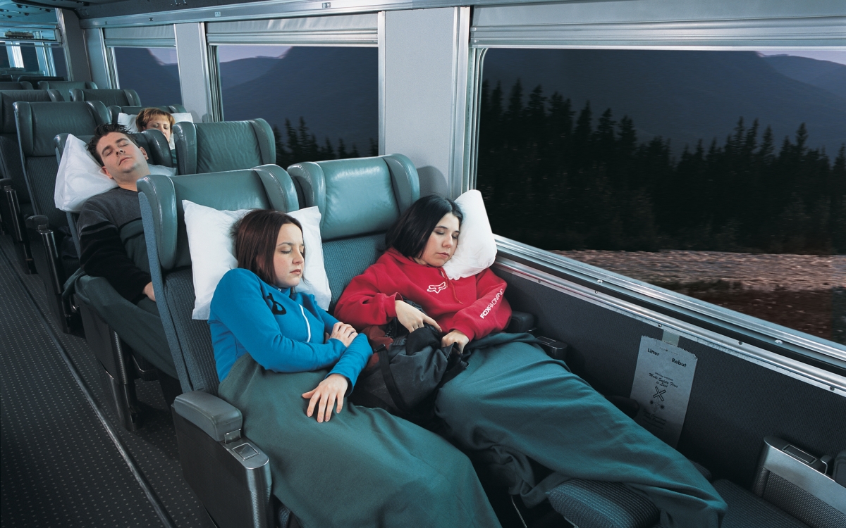 friends sleeping in chairs on via rail Economy class