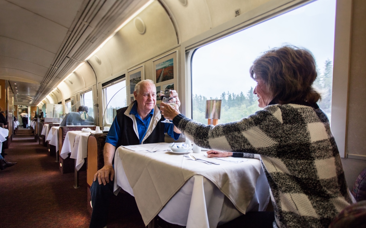 VIA-Rail_ travellers in dining car with window view