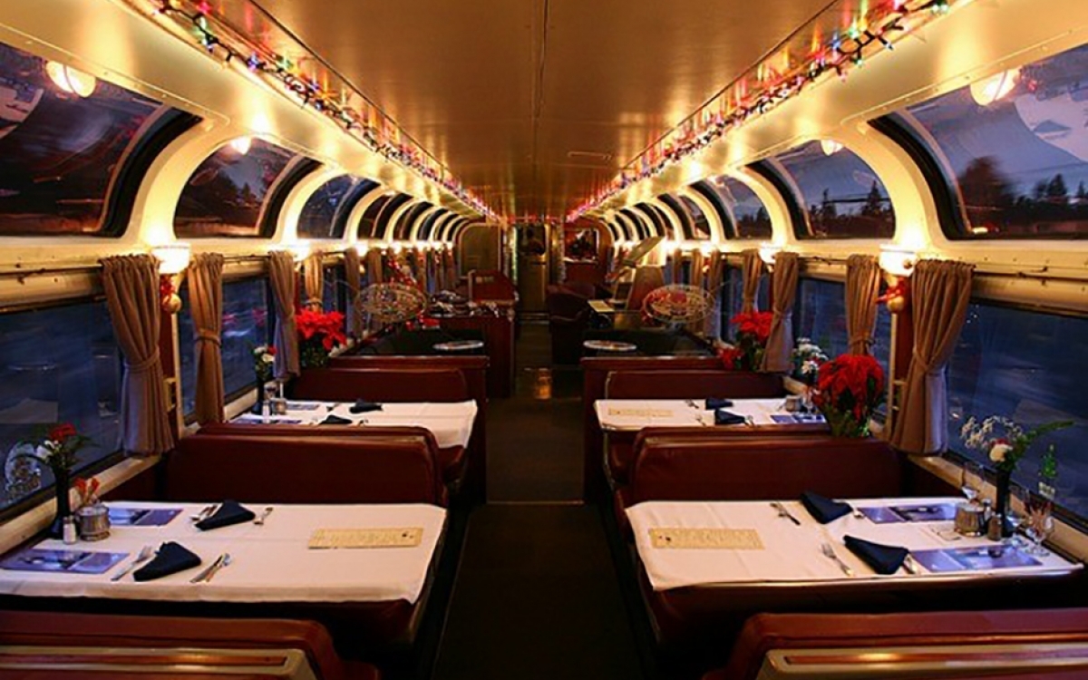 dining room tables decorated for Christmas onboard Amtrak trains