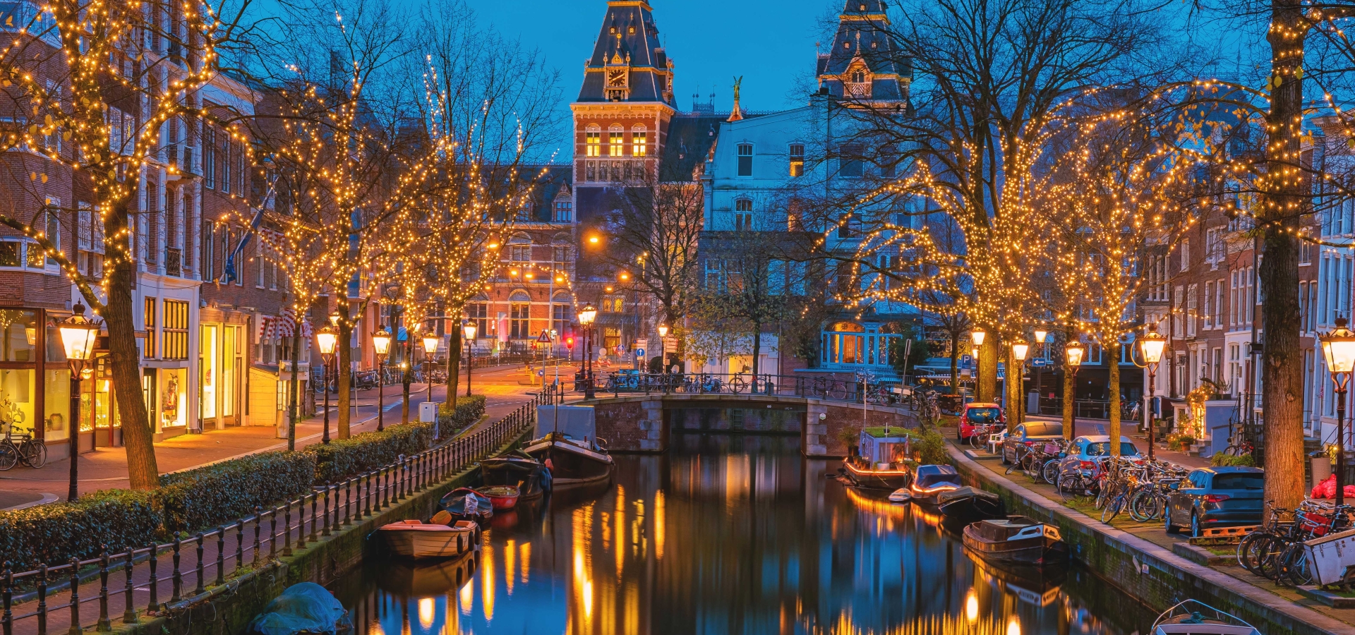 Amsterdam Netherlands canals with Christmas lights during December, canal historical center of Amsterdam at night. Europe