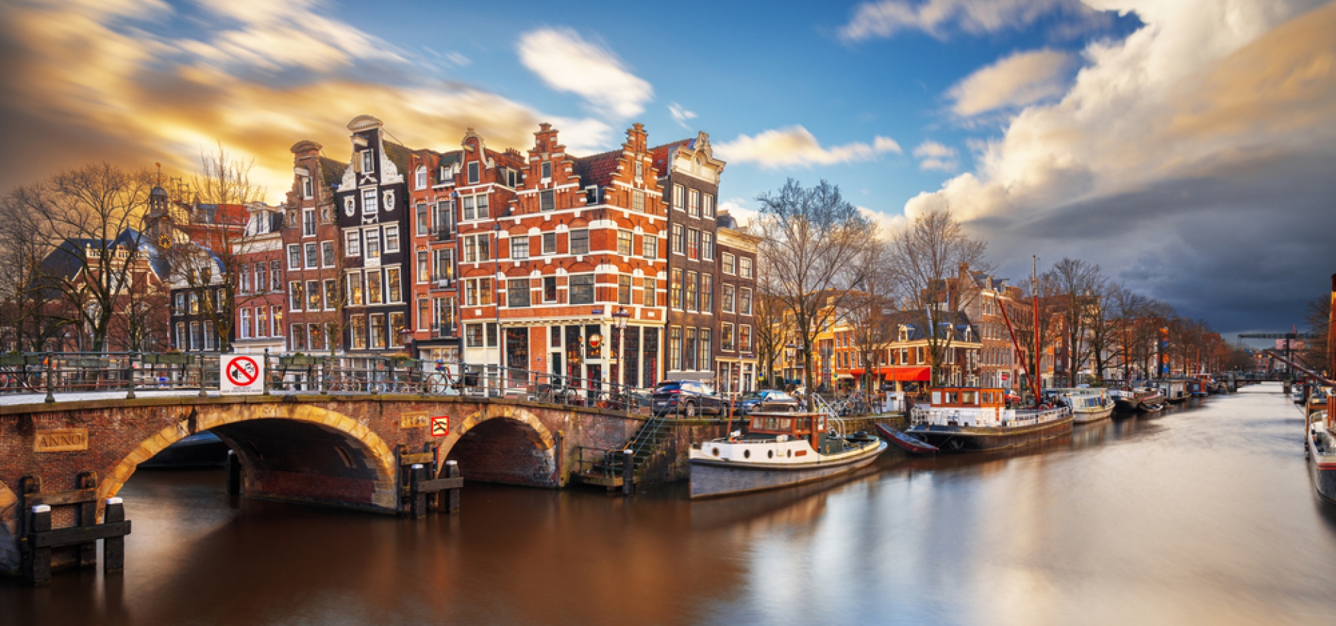 Amsterdam, Netherlands bridges and canals at twilight.
