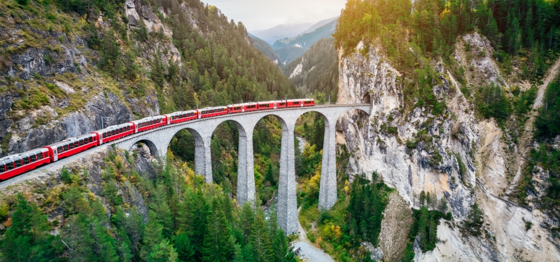 Train crossing Landwasser Viaduct on raethian railway in Filisur