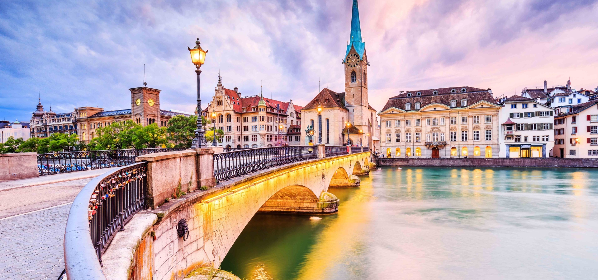 The Fraumünster Church and the Münsterbrücke bridge over the Limmat River in Zurich, Switzerland