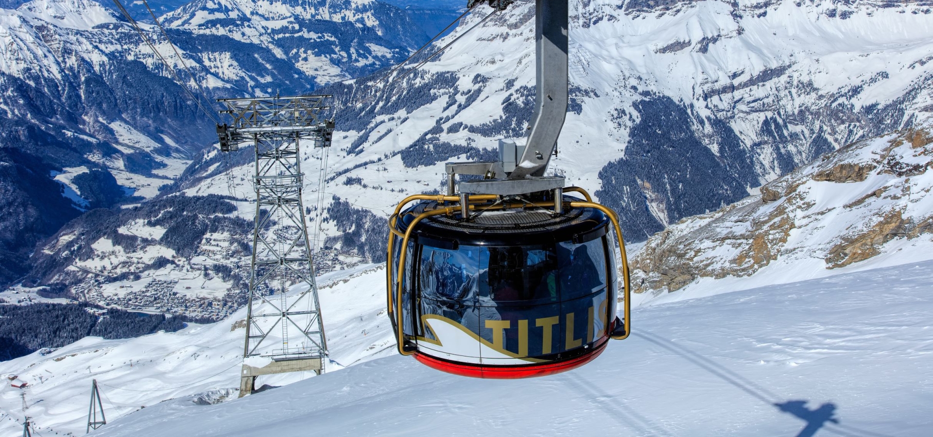 a cable car travels up the mountain
