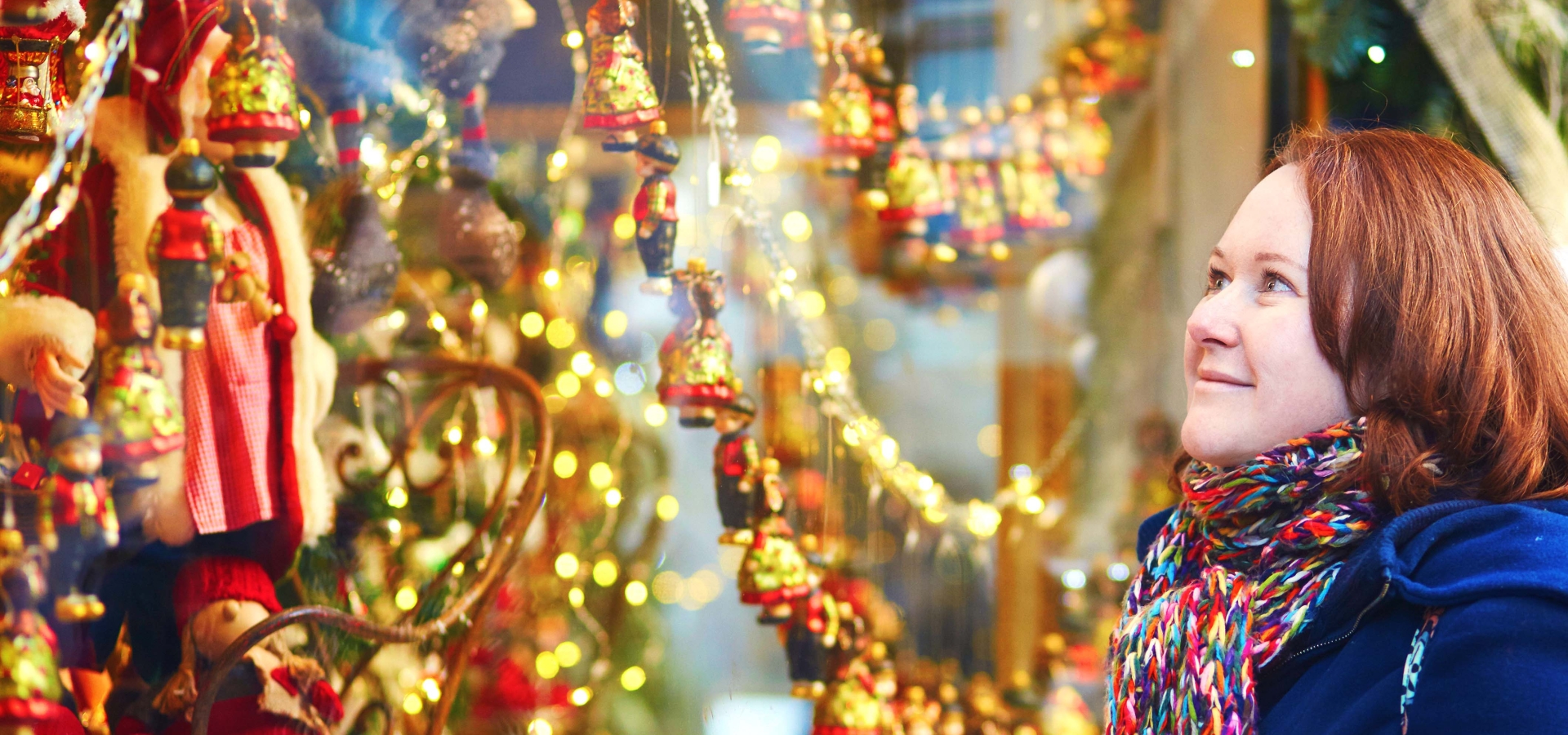 woman window-shopping-at a Christmas-market