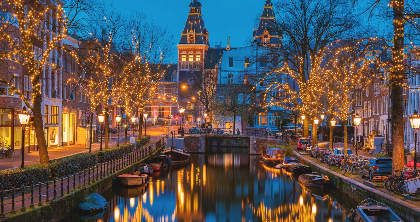 Amsterdam Netherlands canals with Christmas lights during December, canal historical center of Amsterdam at night. Europe