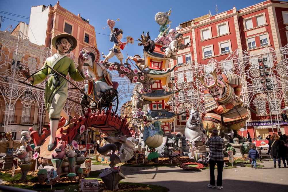 Large wooden statues tower in a city square in Valencia, Spain for the Las Fallas Festival