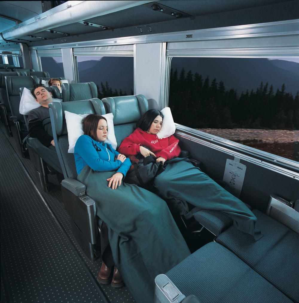 friends sleeping in chairs on via rail Economy class