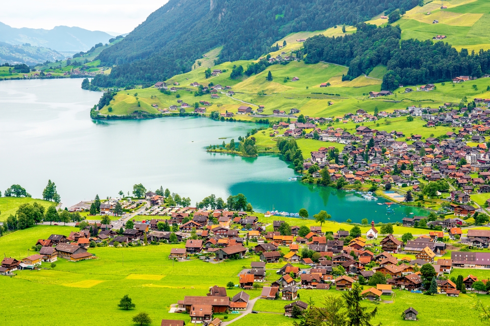 Beautiful rural landscape view on the green mountains and village in Switzerland